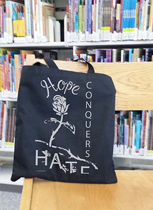 hope conquers hate on bag in library