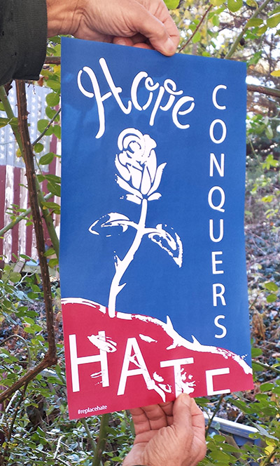 holding hope conquers hate poster